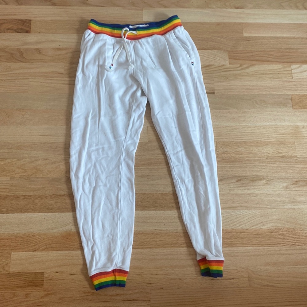 This is a white and rainbow pattern sweatpants.